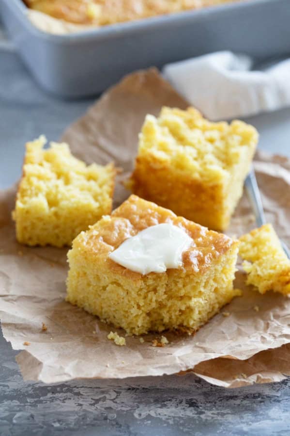 Sweet Boston Market Cornbread with a fork, topped with butter.