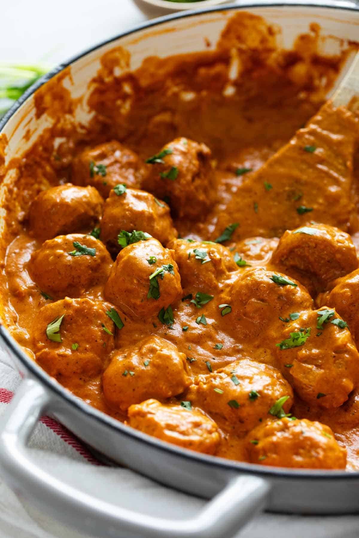 Butter Chicken Meatballs in a pan.