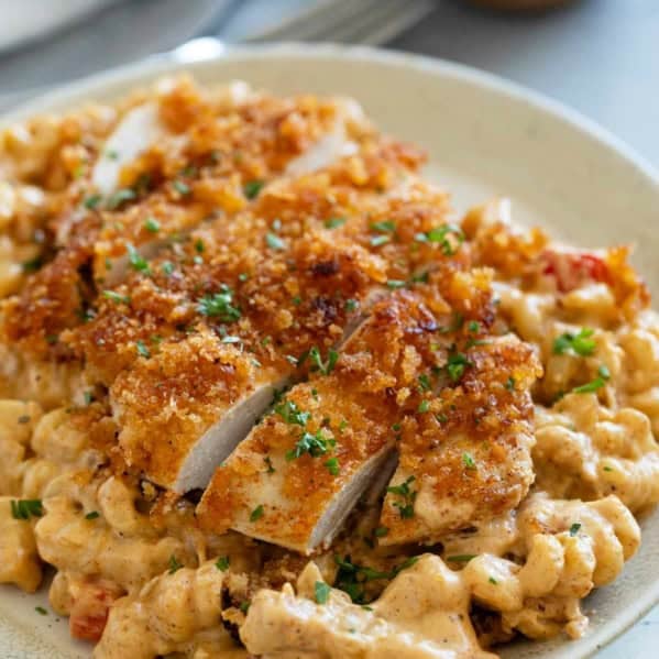 Crispy Cajun Chicken sliced and served over Cajun spiced pasta.