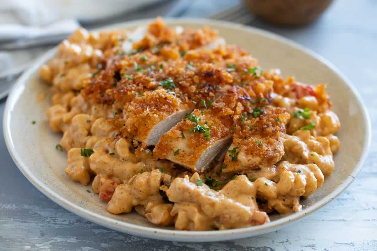 Sliced Crispy Cajun chicken on top of creamy Cajun pasta.