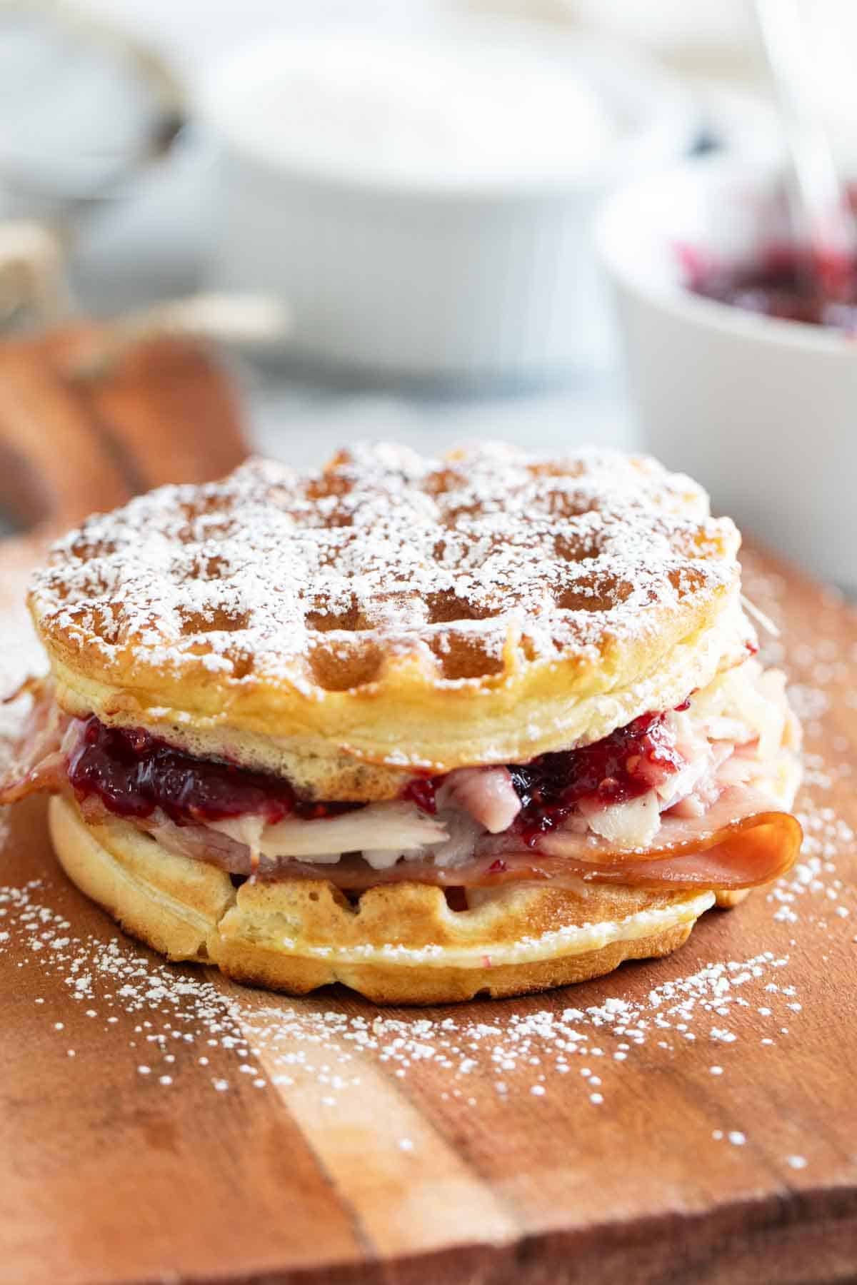Monte Cristo Waffle Sandwich dusted with powdered sugar.