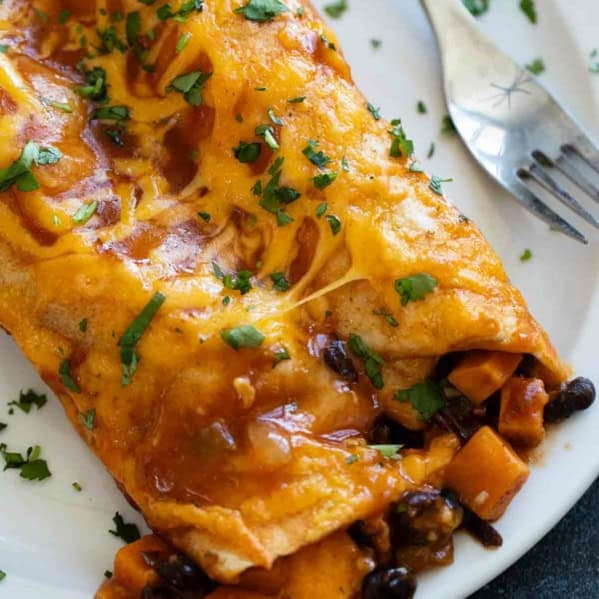Sweet Potato and Black Bean Enchiladas with cilantro and cheese.