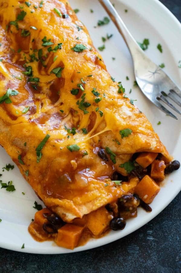 Sweet Potato and Black Bean Enchiladas with cilantro and cheese.