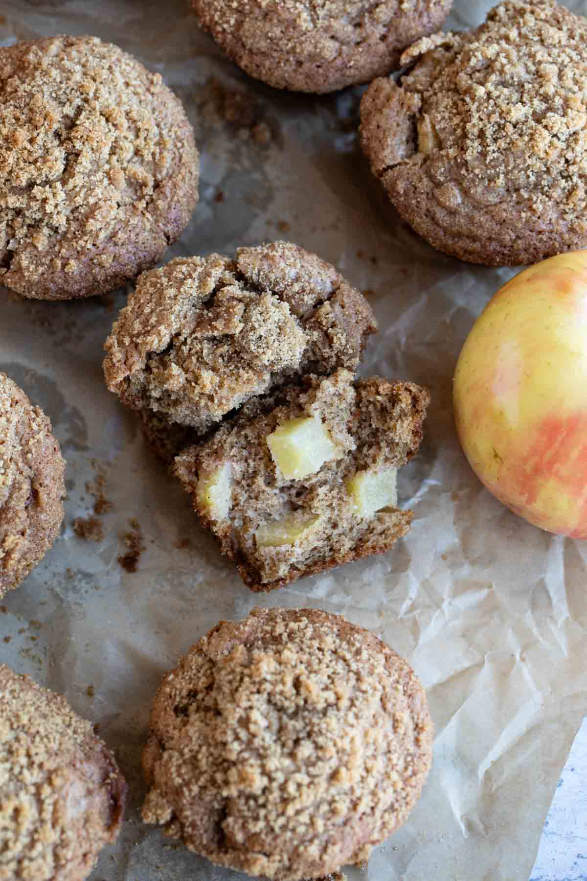 Apple Cinnamon Muffins with one muffin torn in half.