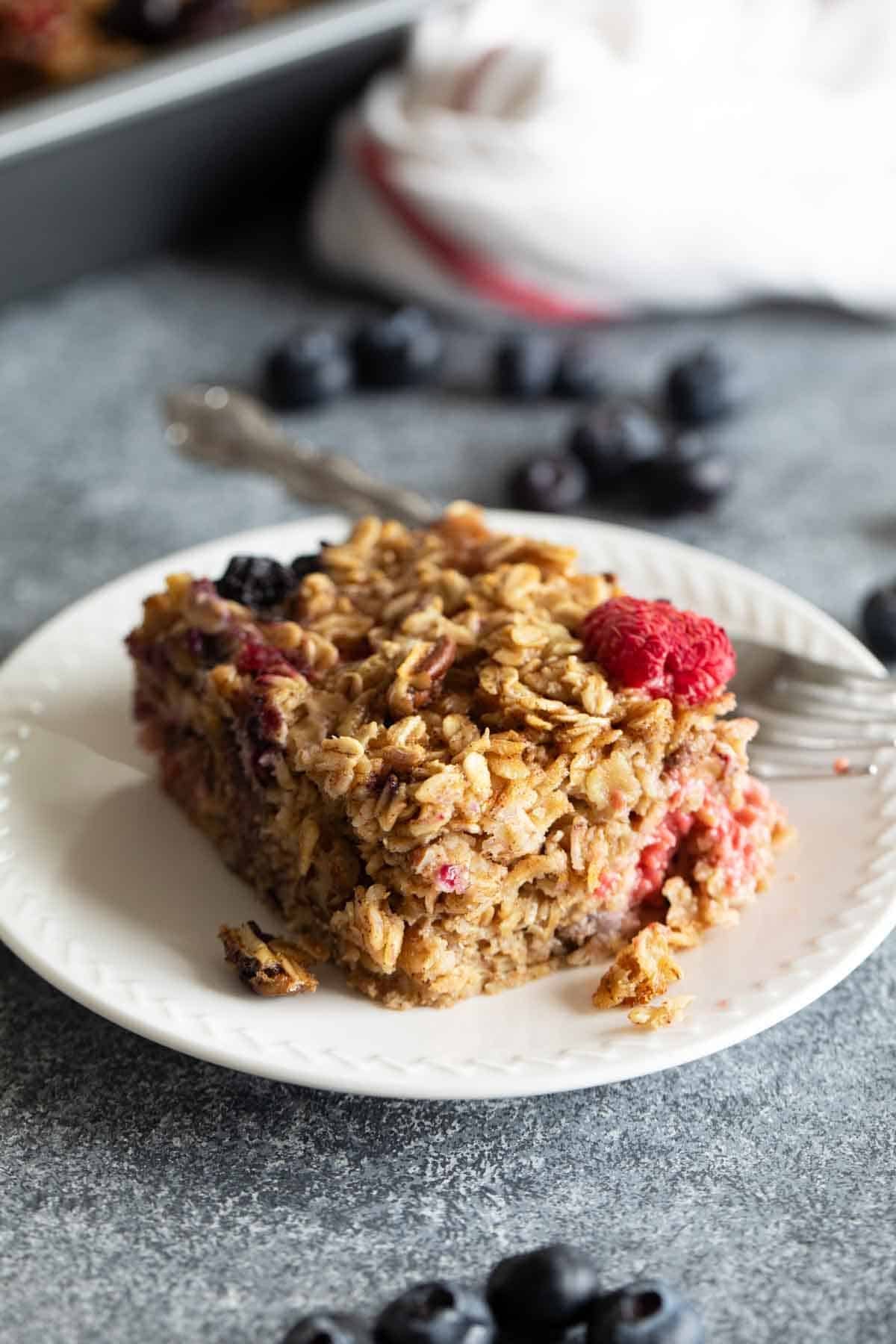 Slice of Baked Oatmeal on a plate with a fork.
