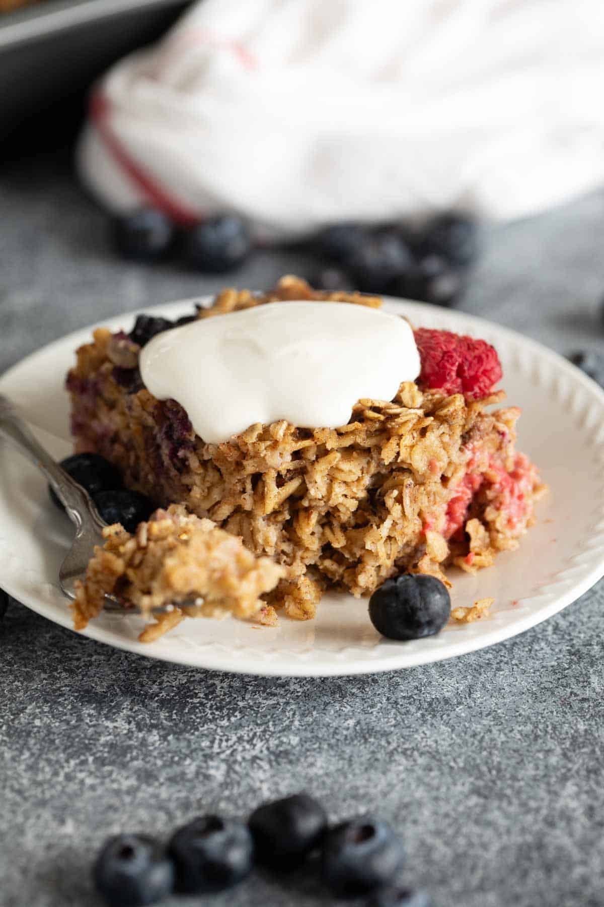 Slice of Baked Oatmeal topped with yogurt.