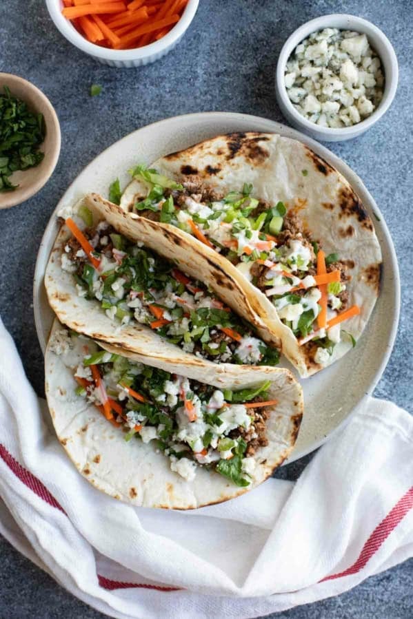 Three buffalo beef tacos made with ground beef and buffalo sauce.