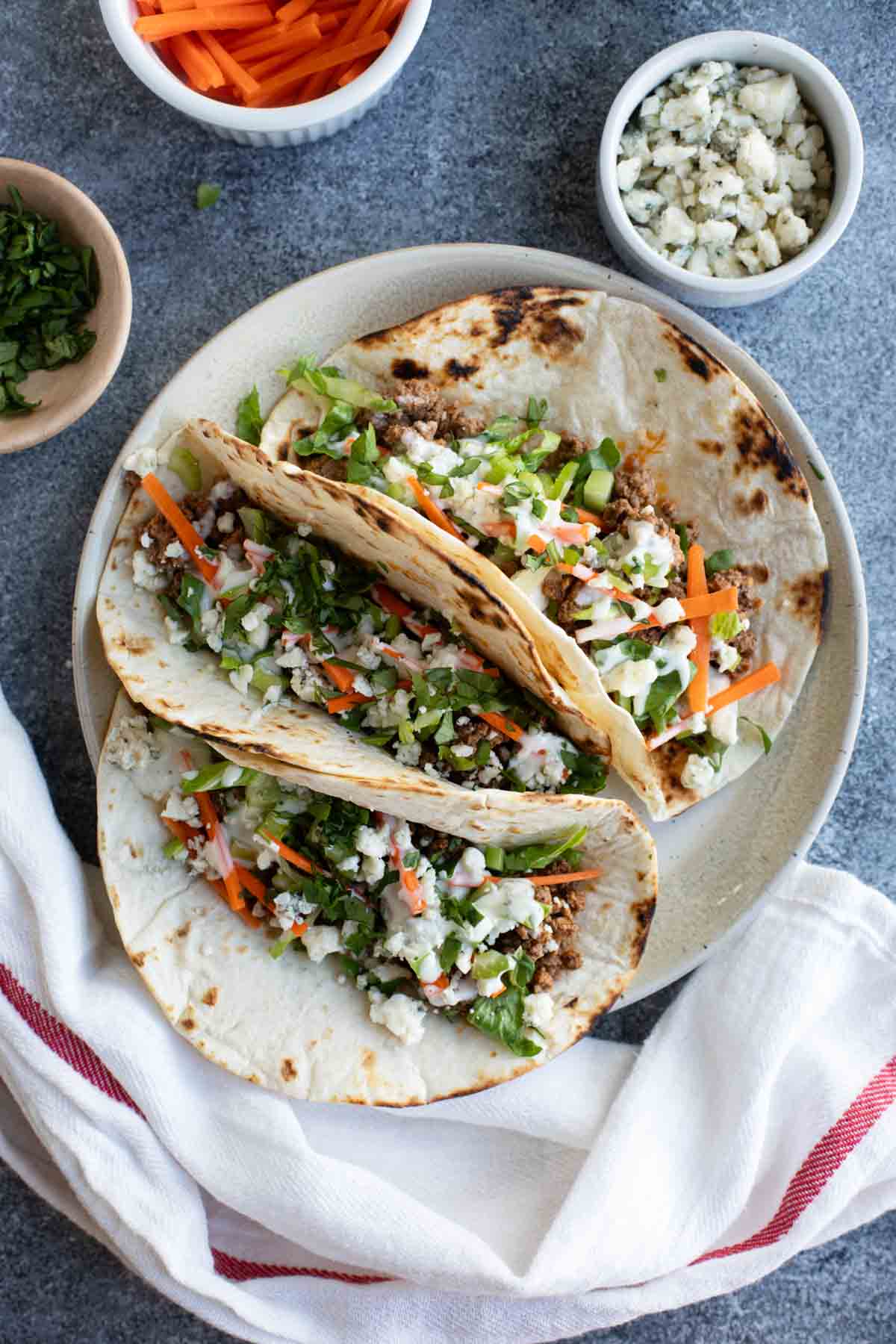 Three buffalo beef tacos made with ground beef and buffalo sauce.