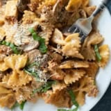 Plate with Chicken Pasta Milano with a fork.