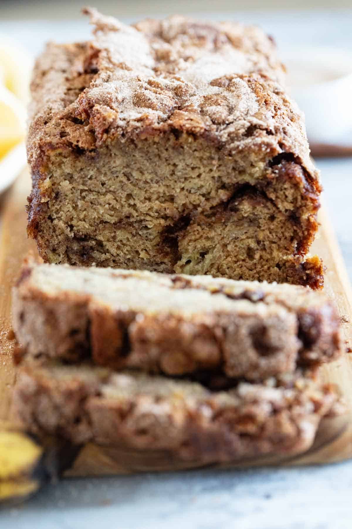 Loaf of cinnamon banana bread cut into slices.