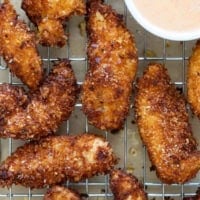 Coconut Chicken Tenders on a cooling rack.