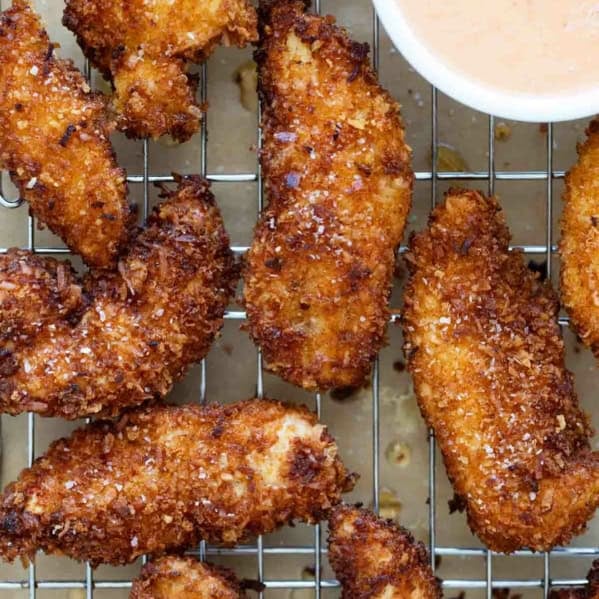Coconut Chicken Tenders on a cooling rack.