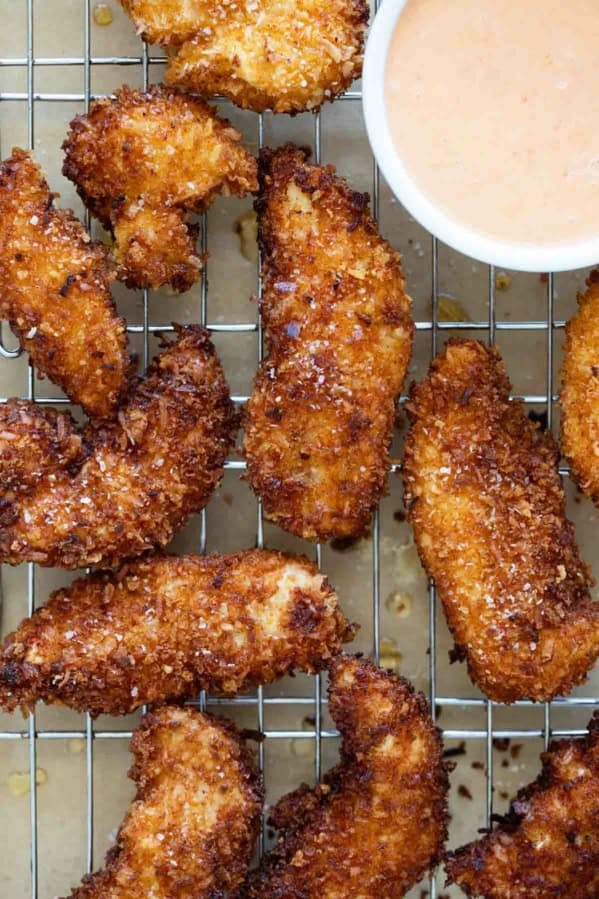 Coconut Chicken Tenders on a cooling rack.