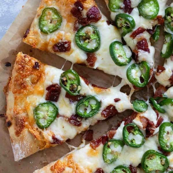 Slices of Jalapeño Popper Pizza with bacon.
