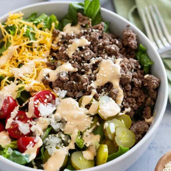 Big Mac Salad topped with sesame seeds in a bowl.