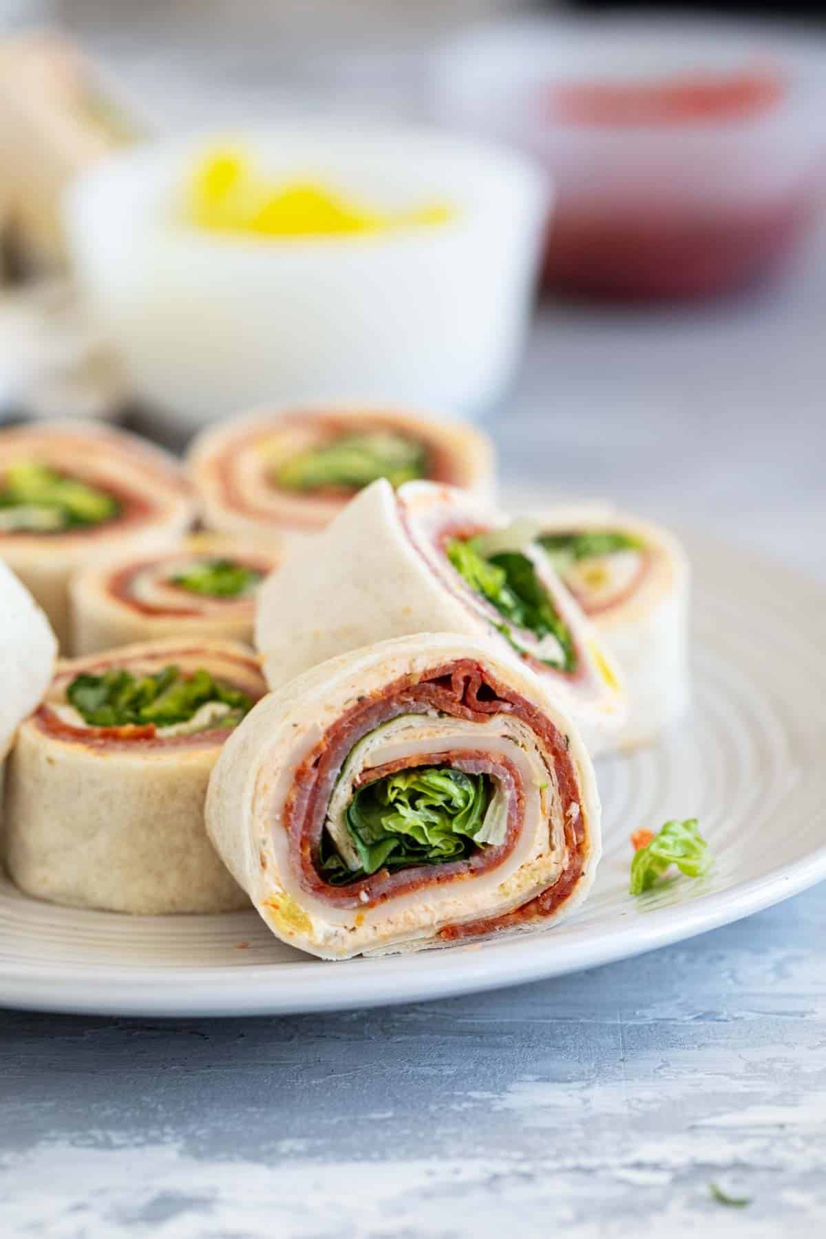 Italian Pinwheels with pepperoni, salami, cheese, and lettuce.