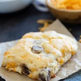 Sausage and Cheese Biscuit filled with shredded cheese and sausage links.