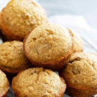 Brown Sugar Muffins stacked on top of each other.
