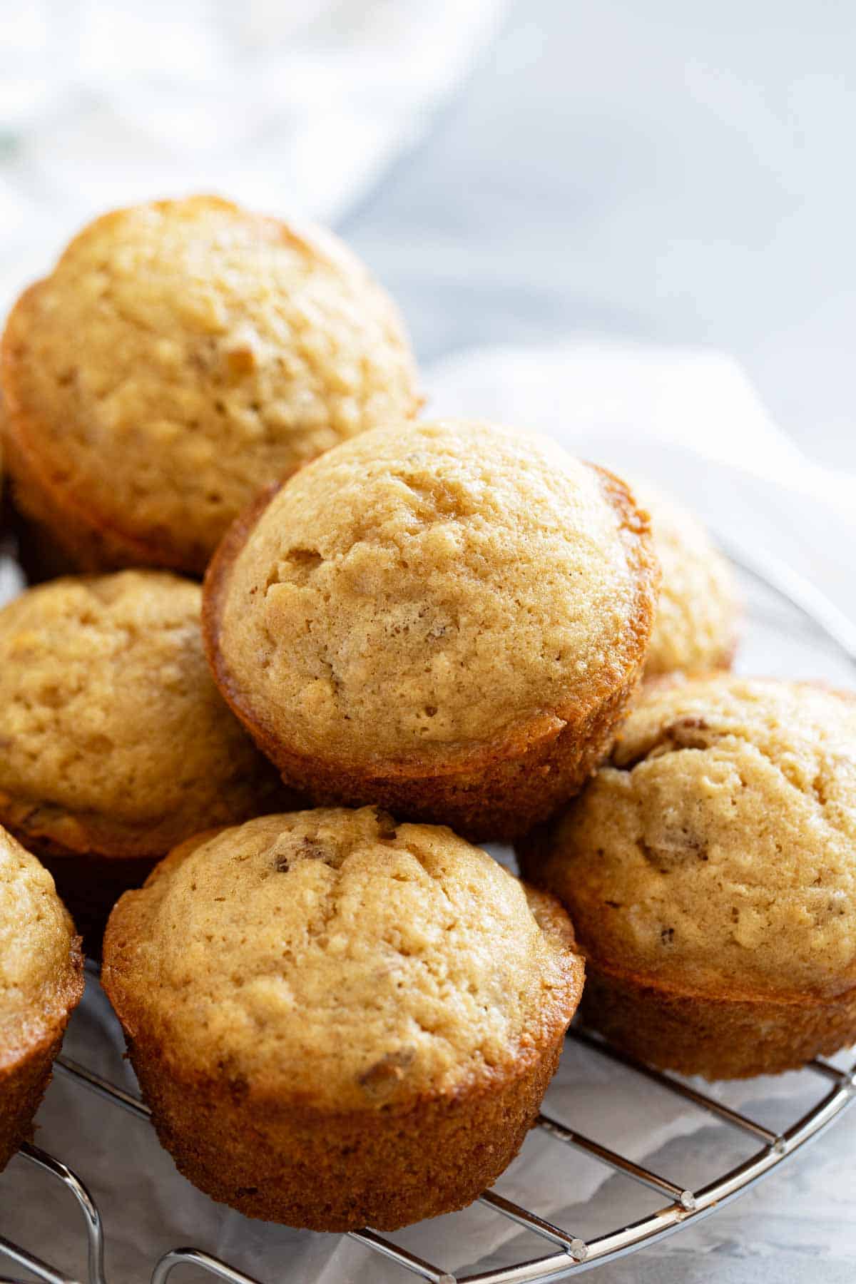 Brown Sugar Muffins stacked on top of each other.