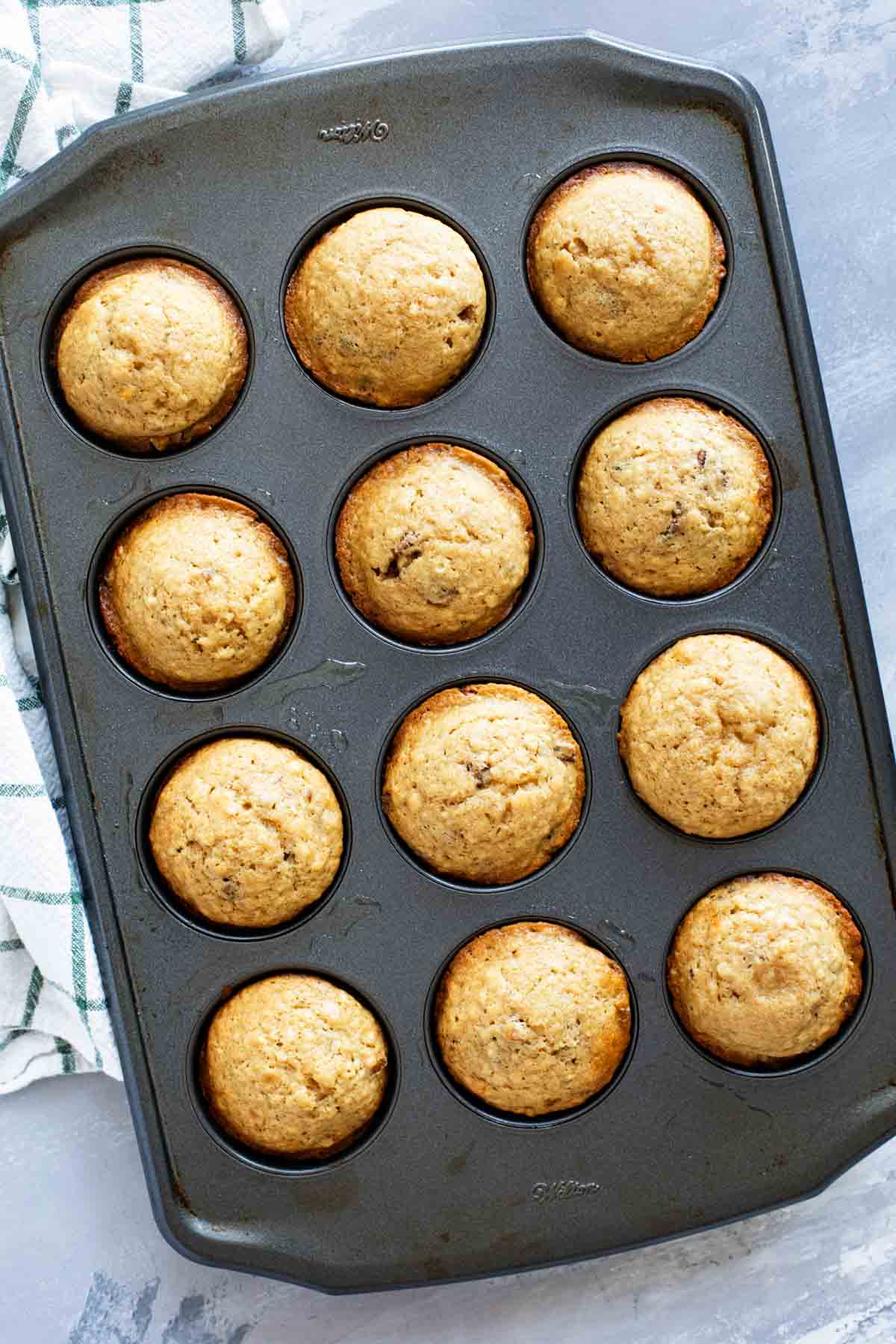 Brown sugar muffins in a baking tin.