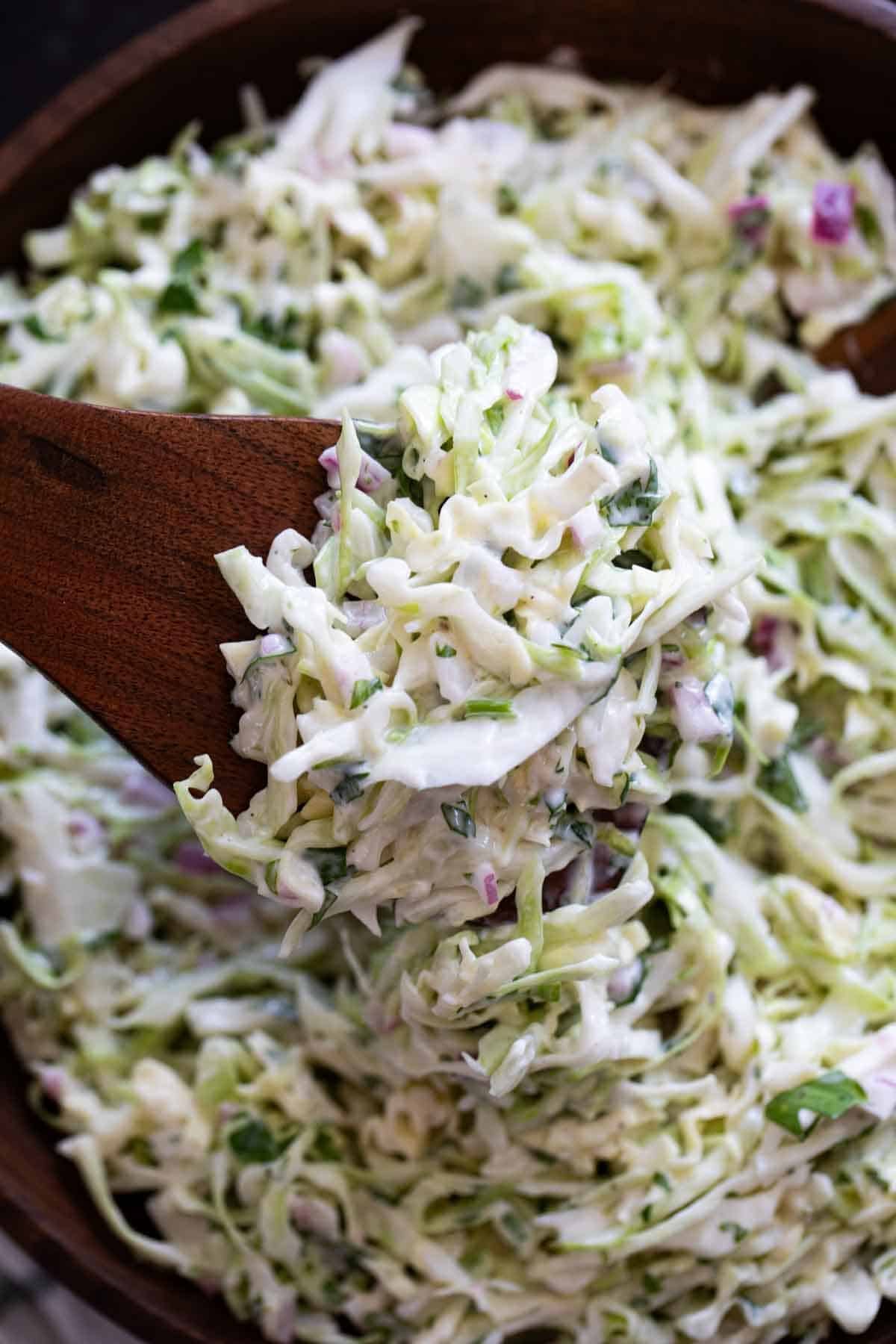 Cilantro Lime Slaw with wooden spoons.