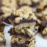 Three Oatmeal Fudge Bars stacked on top of each other.