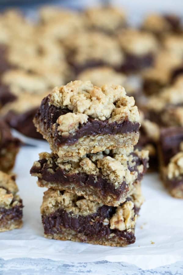 Three Oatmeal Fudge Bars stacked on top of each other.
