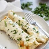 White Chicken Enchiladas on a plate.