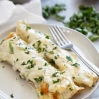 White Chicken Enchiladas on a plate.