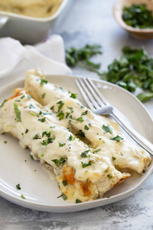 White Chicken Enchiladas on a plate.