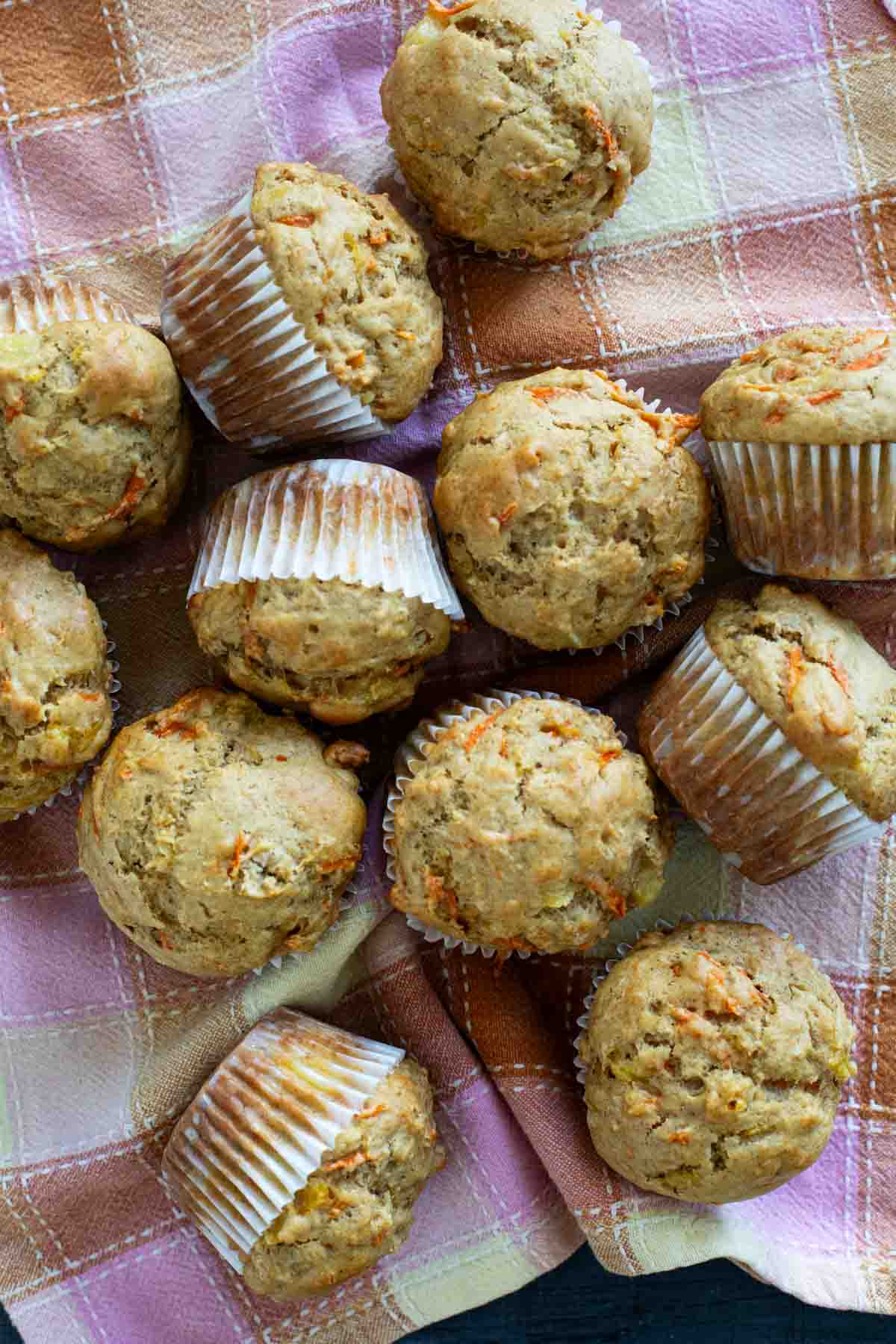Carrot Pineapple Muffins on a colorful towel.
