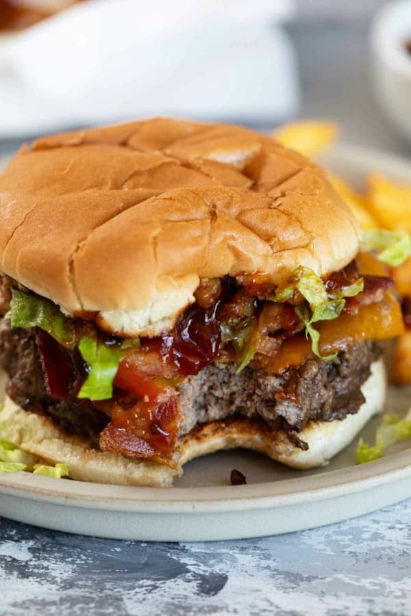Chipotle Honey BBQ Burger with a bite taken from it.