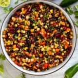 Bowl of Mexican Bean Salad with three kinds of beans and vegetables.