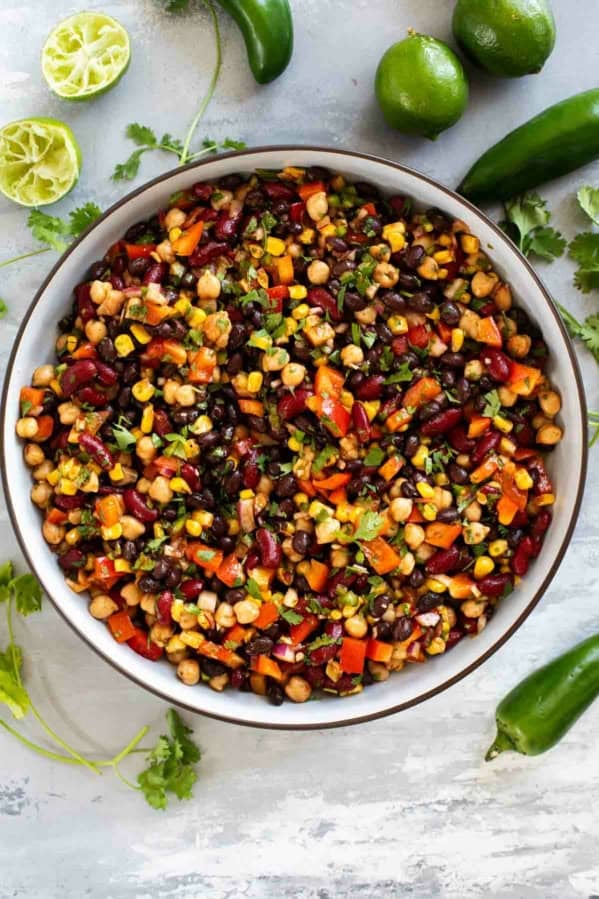 Bowl of Mexican Bean Salad with three kinds of beans and vegetables.