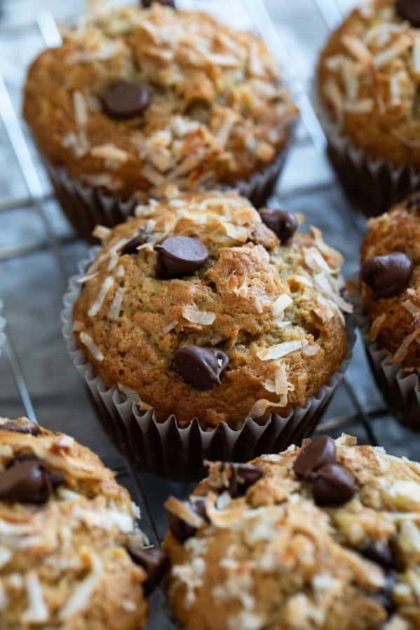 Banana Chocolate Chip Muffins with Coconut, topped with extra chocolate chips and coconut.