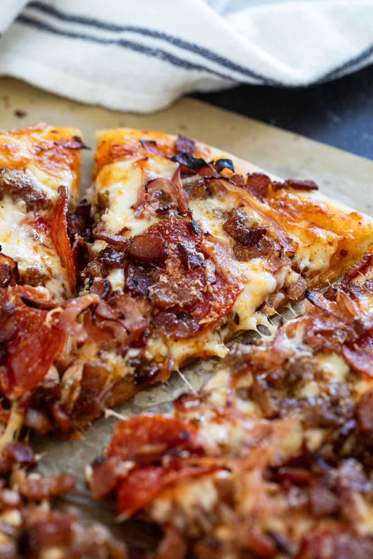 Meat Lover's Pizza with sausage, bacon, pepperoni, and ham.