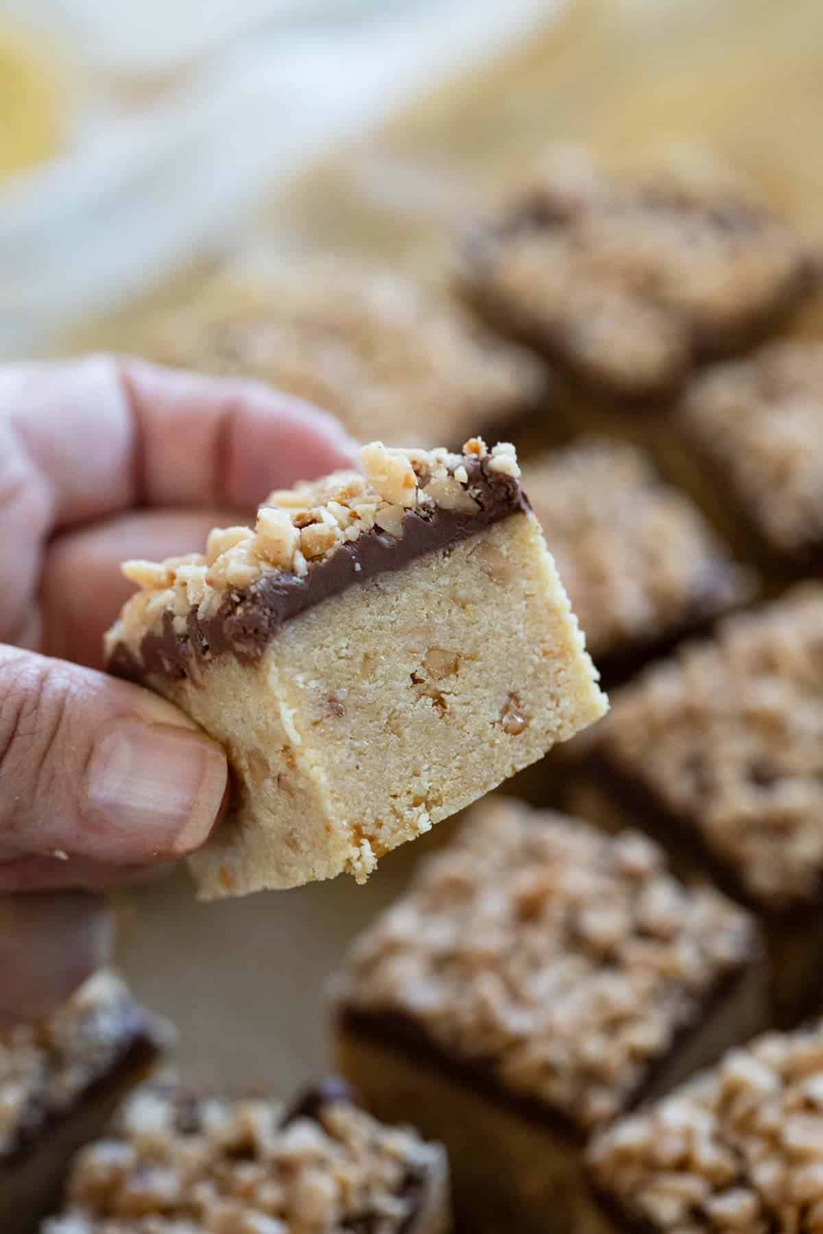 Hand holding a Ritz Cracker Toffee Bar.