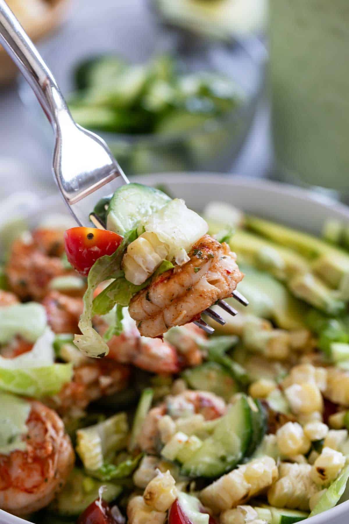 Bite of Shrimp and Corn Salad on a fork.