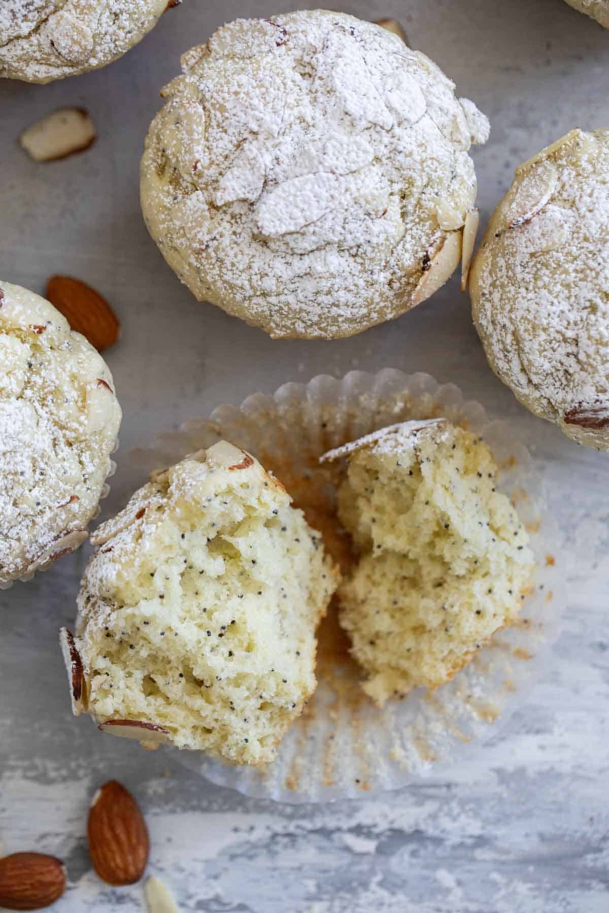 Almond Poppy Seed Muffin torn in half to show interior texture.