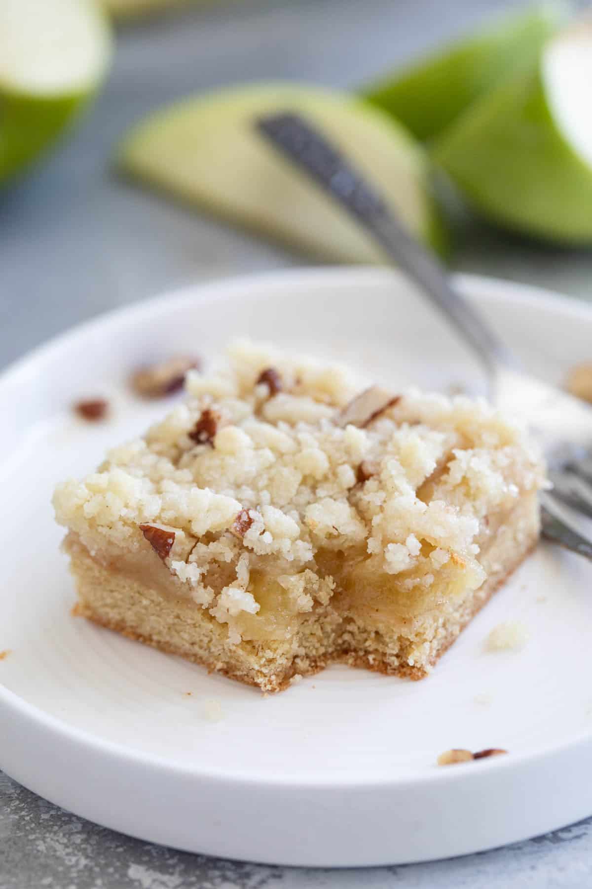 Apple Pie Bar on a plate with a bite taken from it.