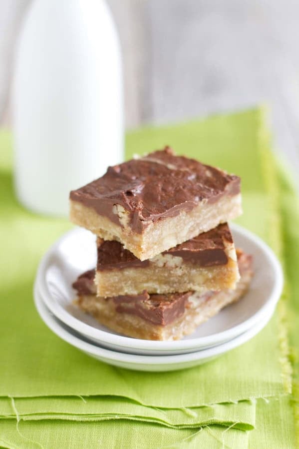 Chocolate Pecan Toffee Bars stacked on top of each other.
