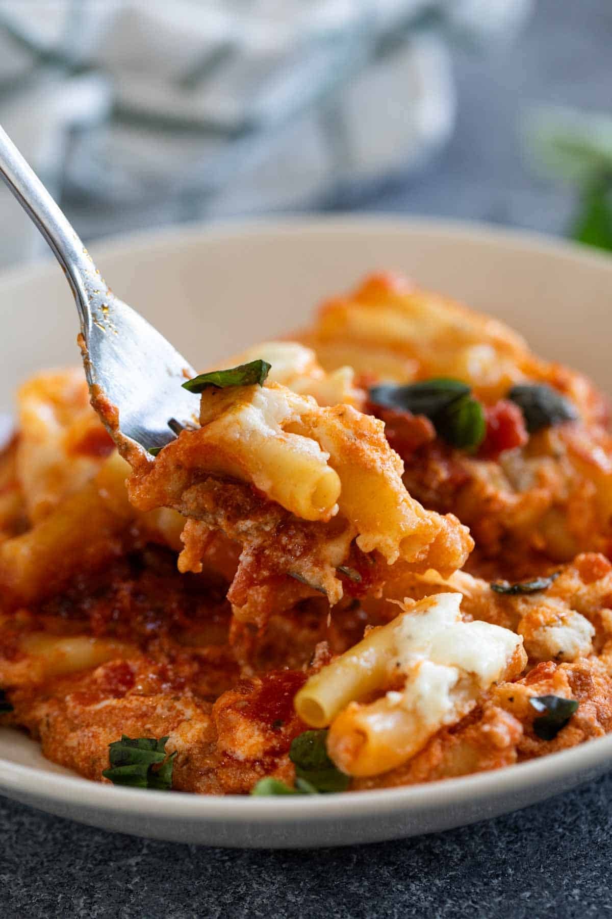 Fork with a bite of Crock Pot Baked Ziti.