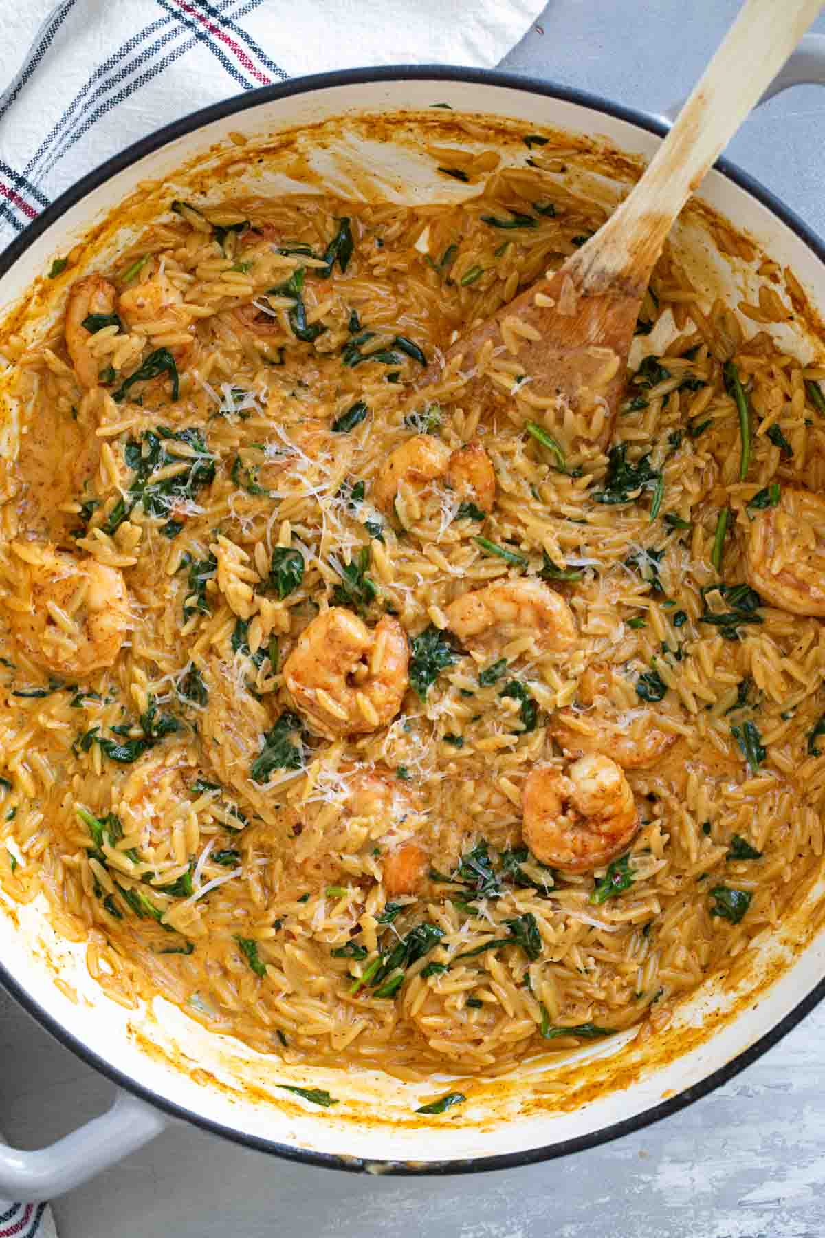 Shrimp Orzo Skillet topped with parmesan cheese.