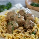 Swedish Meatballs and sauce over egg noodles, topped with parsley.