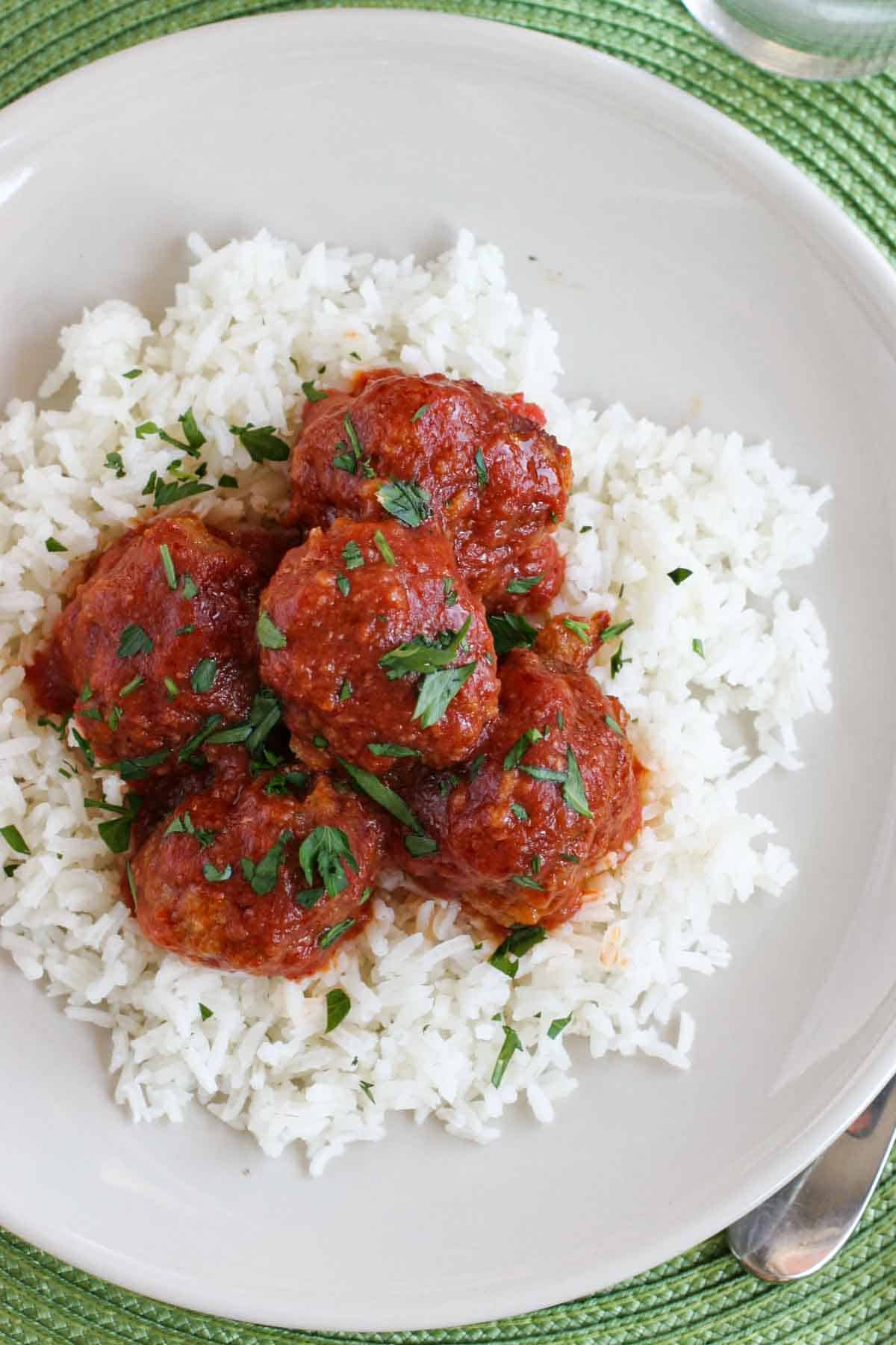 Tamale Balls served over rice.