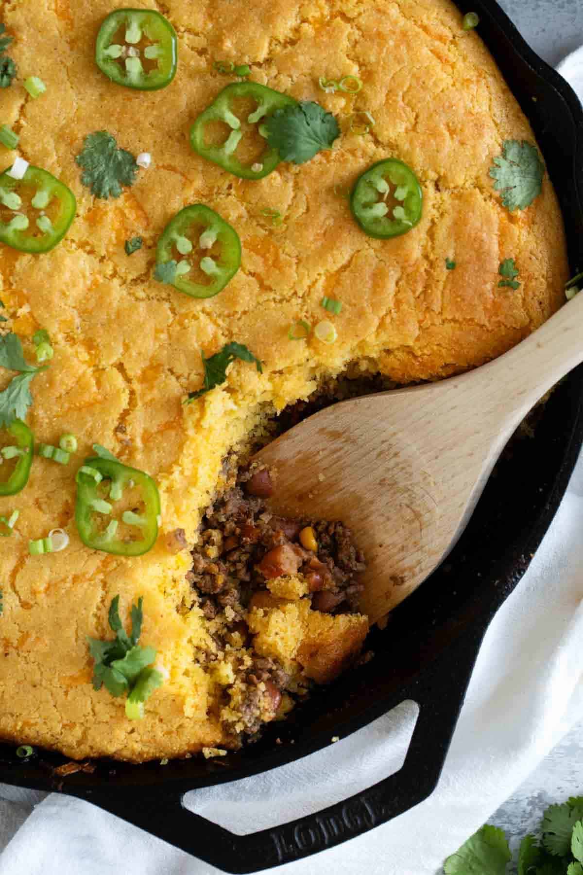 Chili Cornbread Casserole in a cast iron skillet.