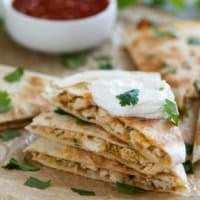 Creamy Chicken Quesadillas stacked on top of each other.