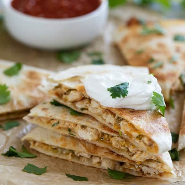 Creamy Chicken Quesadillas stacked on top of each other.