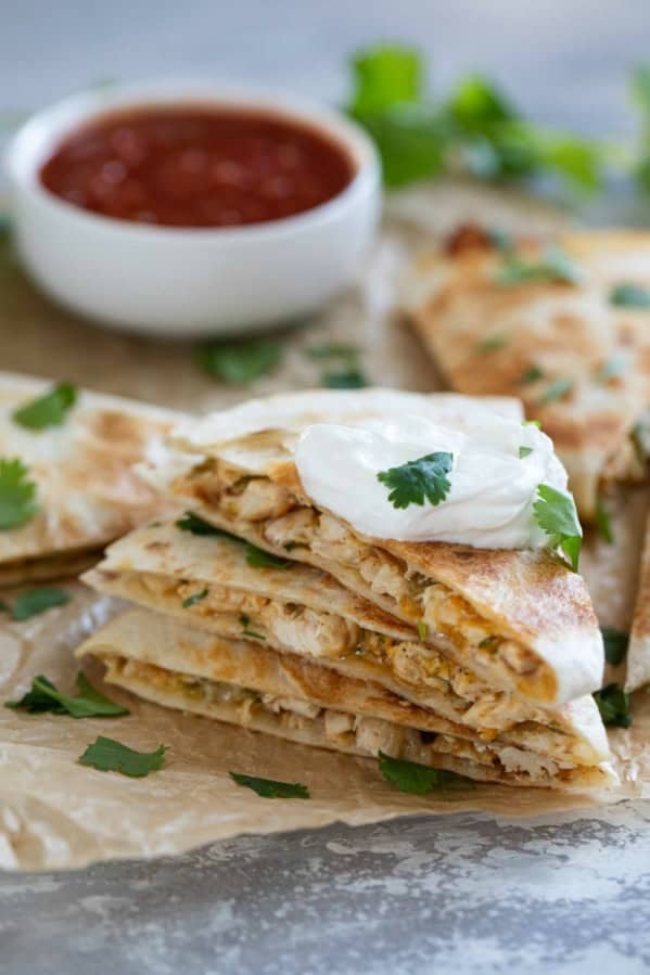 Creamy Chicken Quesadillas stacked on top of each other.
