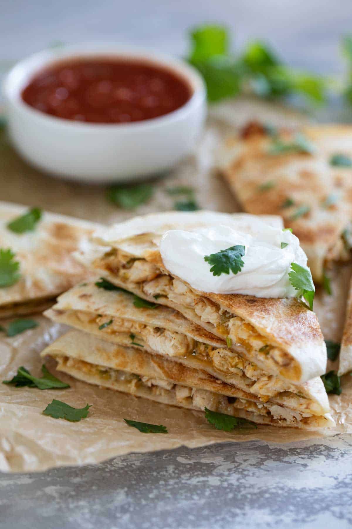 Creamy Chicken Quesadillas stacked on top of each other.